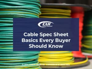 Stacks of colorful coiled cable on spools. Article title.